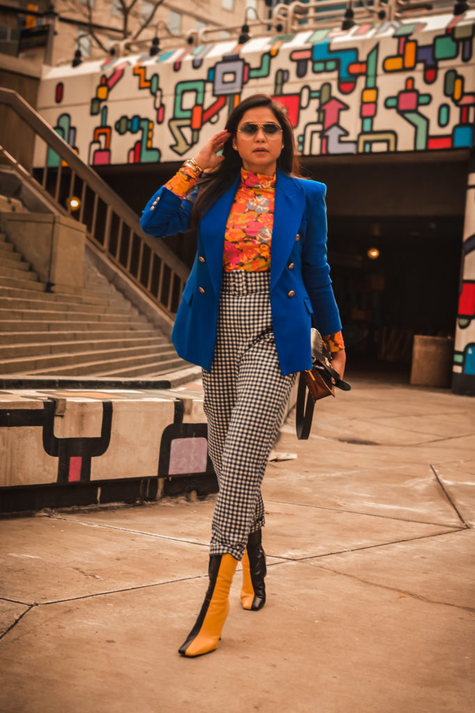 ashion trend report, trends to welcome in 2021, I am wearing a pair of gingham pants, blue blazer, orange printed turtleneck, a quilted puffer vest and colorblock boots, Zara mania, myriad musings, saumya shiohare 