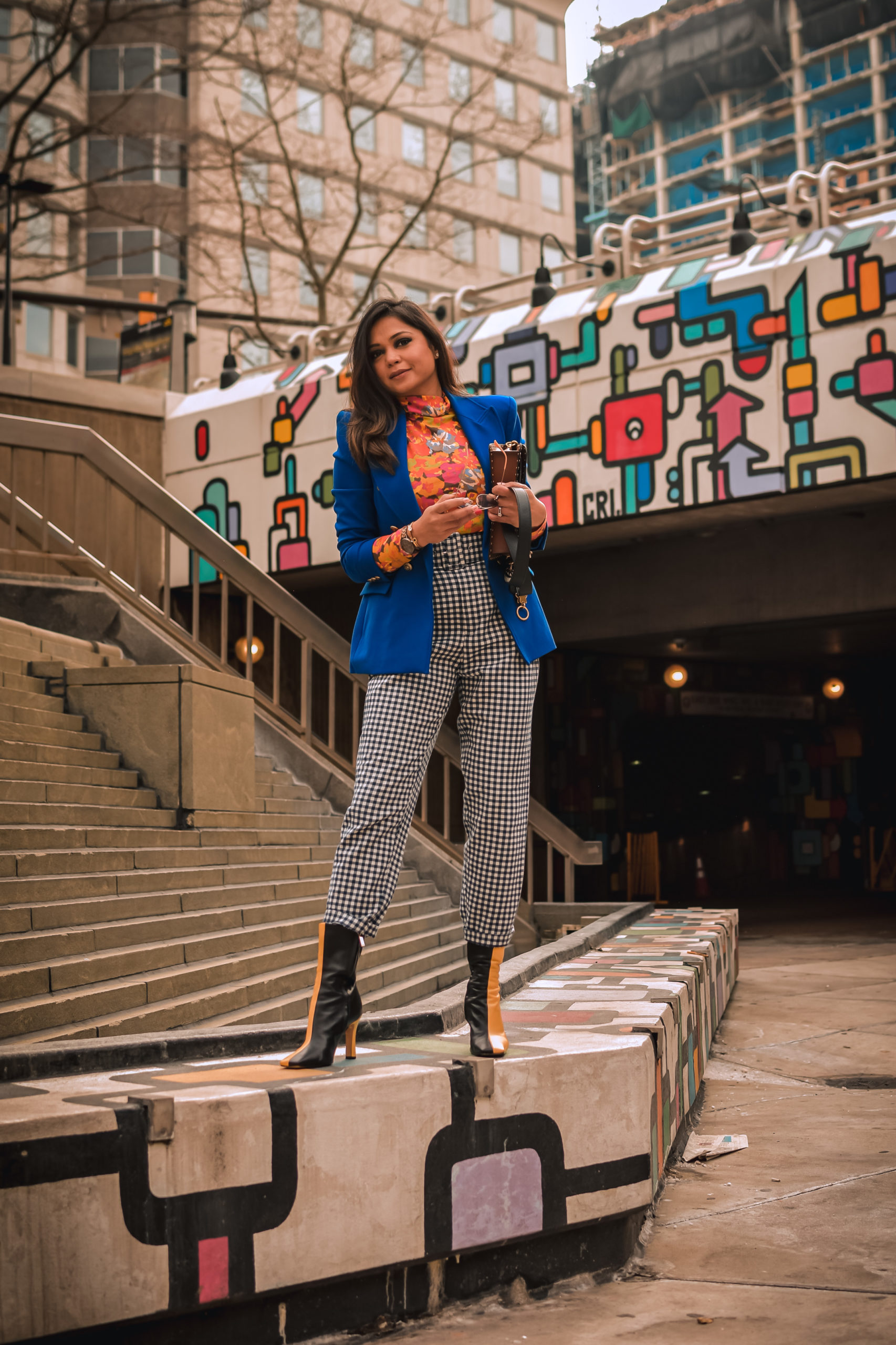 ashion trend report, trends to welcome in 2021, I am wearing a pair of gingham pants, blue blazer, orange printed turtleneck, a quilted puffer vest and colorblock boots, Zara mania, myriad musings, saumya shiohare