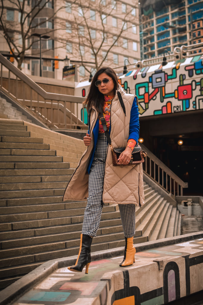 ashion trend report, trends to welcome in 2021, I am wearing a pair of gingham pants, blue blazer, orange printed turtleneck, a quilted puffer vest and colorblock boots, Zara mania, myriad musings, saumya shiohare