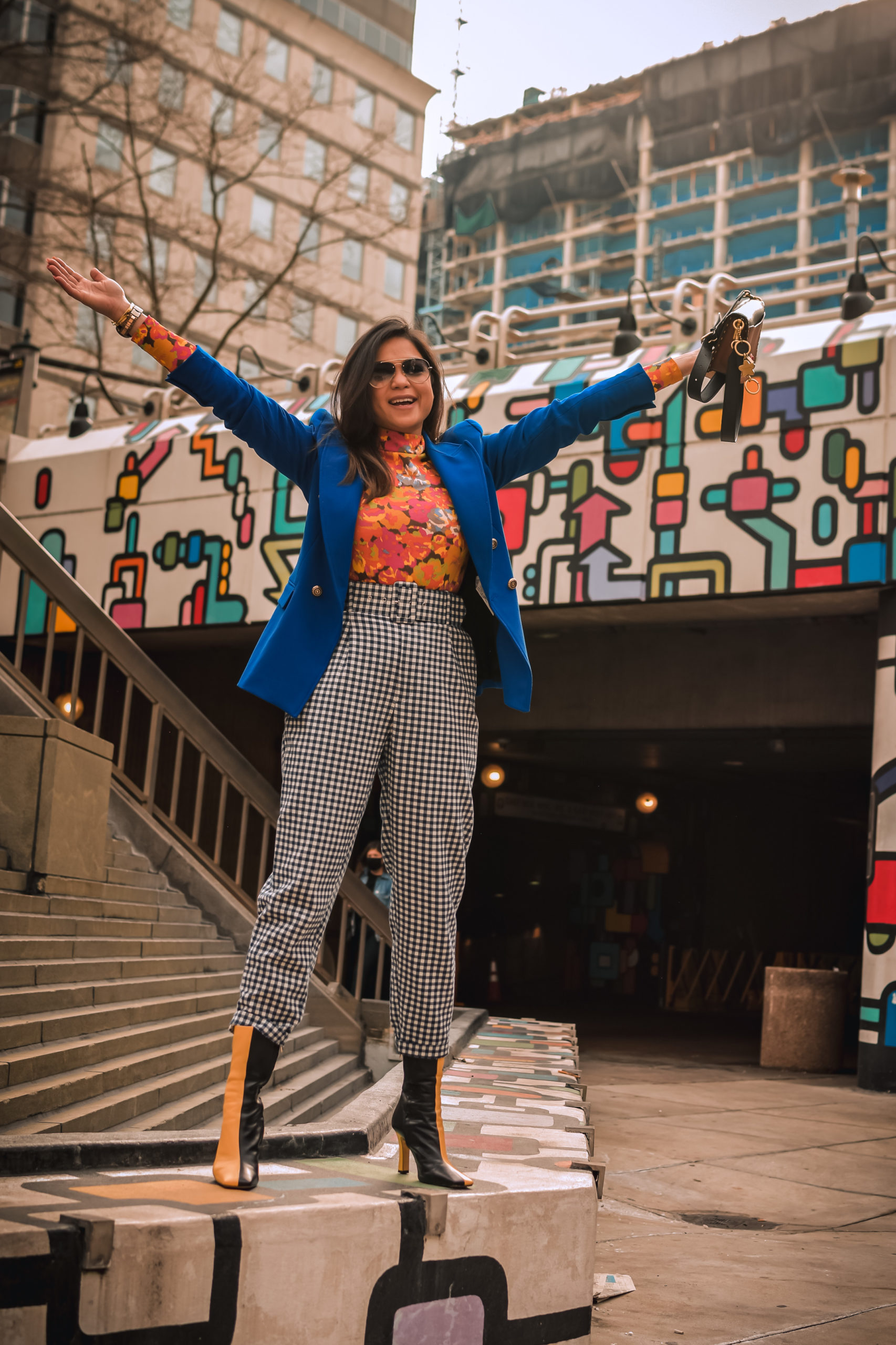 ashion trend report, trends to welcome in 2021, I am wearing a pair of gingham pants, blue blazer, orange printed turtleneck, a quilted puffer vest and colorblock boots, Zara mania, myriad musings, saumya shiohare