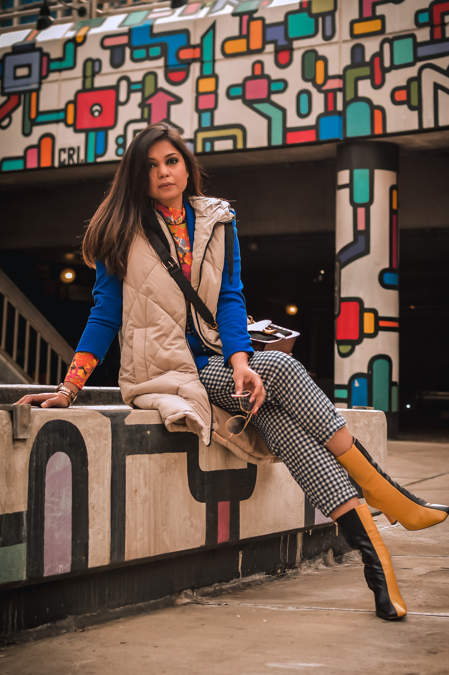 fashion trend report, trends to welcome in 2021, I am wearing a pair of gingham pants, blue blazer, orange printed turtleneck, a quilted puffer vest and colorblock boots, Zara mania, myriad musings, saumya shiohare