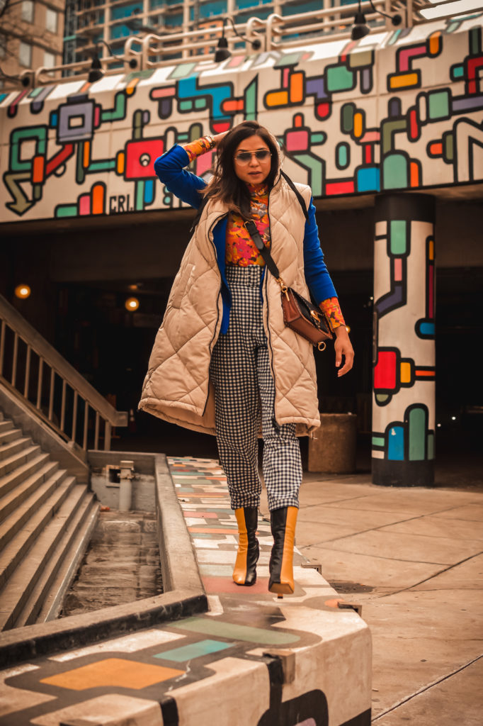 ashion trend report, trends to welcome in 2021, I am wearing a pair of gingham pants, blue blazer, orange printed turtleneck, a quilted puffer vest and colorblock boots, Zara mania, myriad musings, saumya shiohare