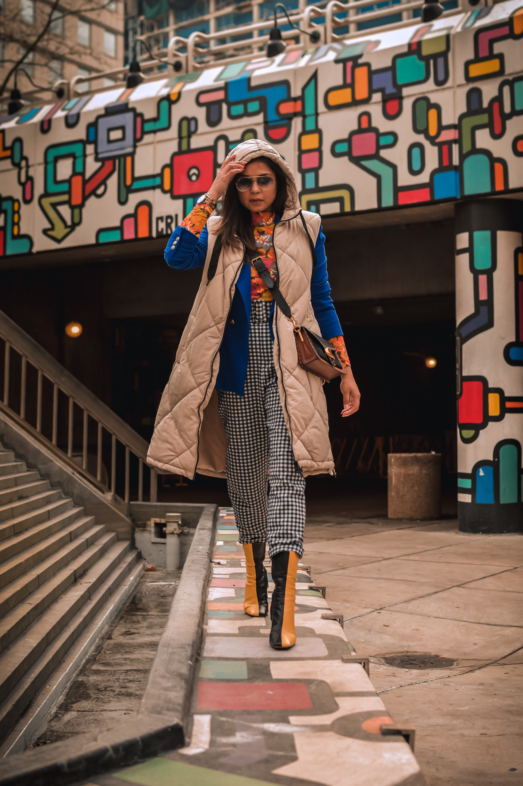 ashion trend report, trends to welcome in 2021, I am wearing a pair of gingham pants, blue blazer, orange printed turtleneck, a quilted puffer vest and colorblock boots, Zara mania, myriad musings, saumya shiohare 