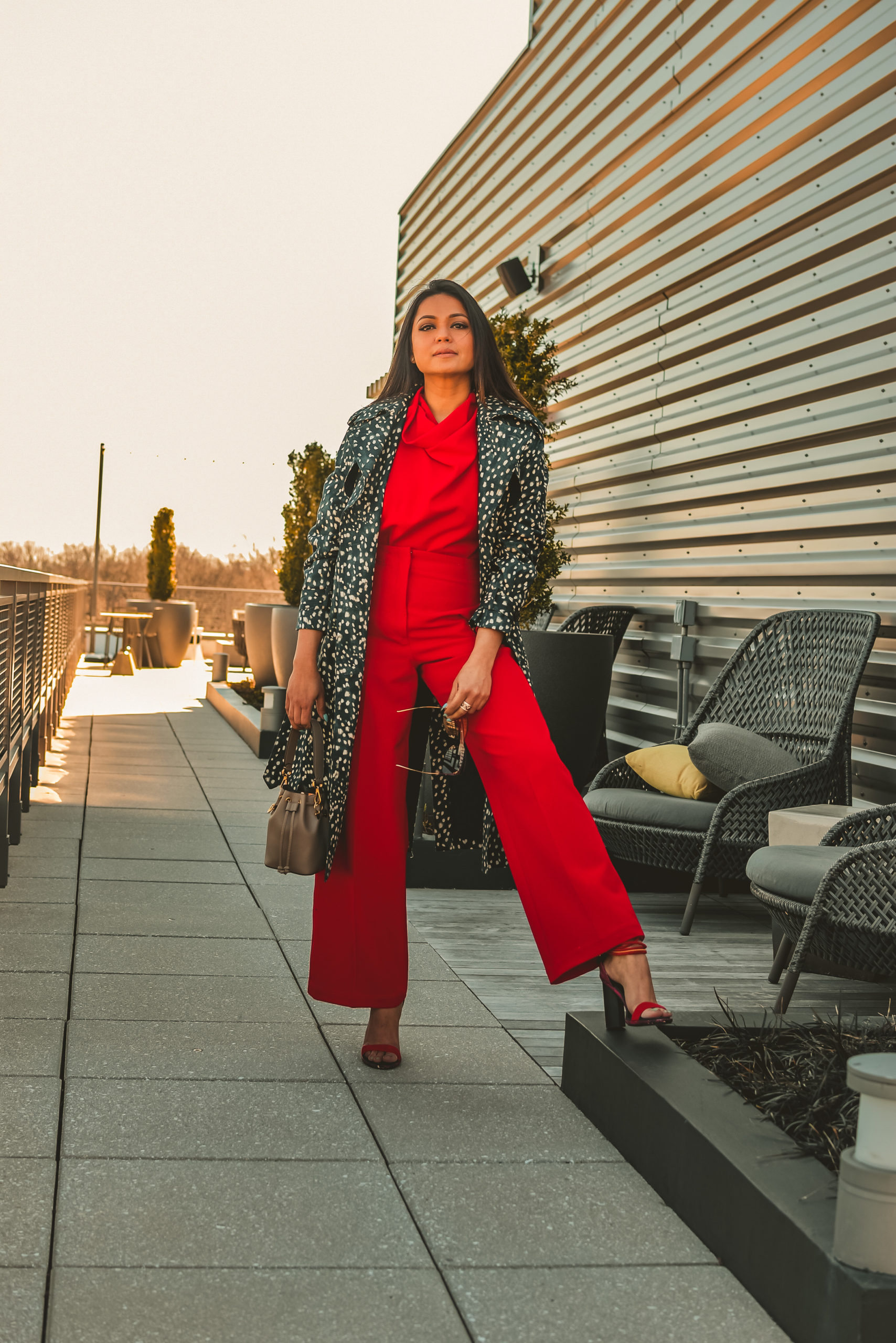 I am wearing a red pant and red blouse set with a pair of read sandals and a printed trench. this is my office look, street style look, spring outfit. Myriad Musings, saumya shiohare 