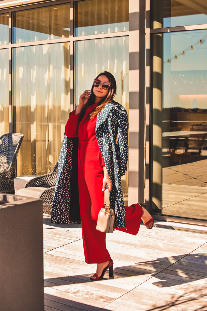 I am wearing a red pant and red blouse set with a pair of read sandals and a printed trench. this is my office look, street style look, spring outfit. Myriad Musings, saumya shiohare 