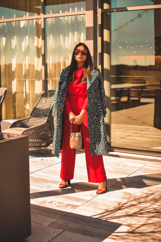 I am wearing a red pant and red blouse set with a pair of read sandals and a printed trench. this is my office look, street style look, spring outfit. Myriad Musings, saumya shiohare 