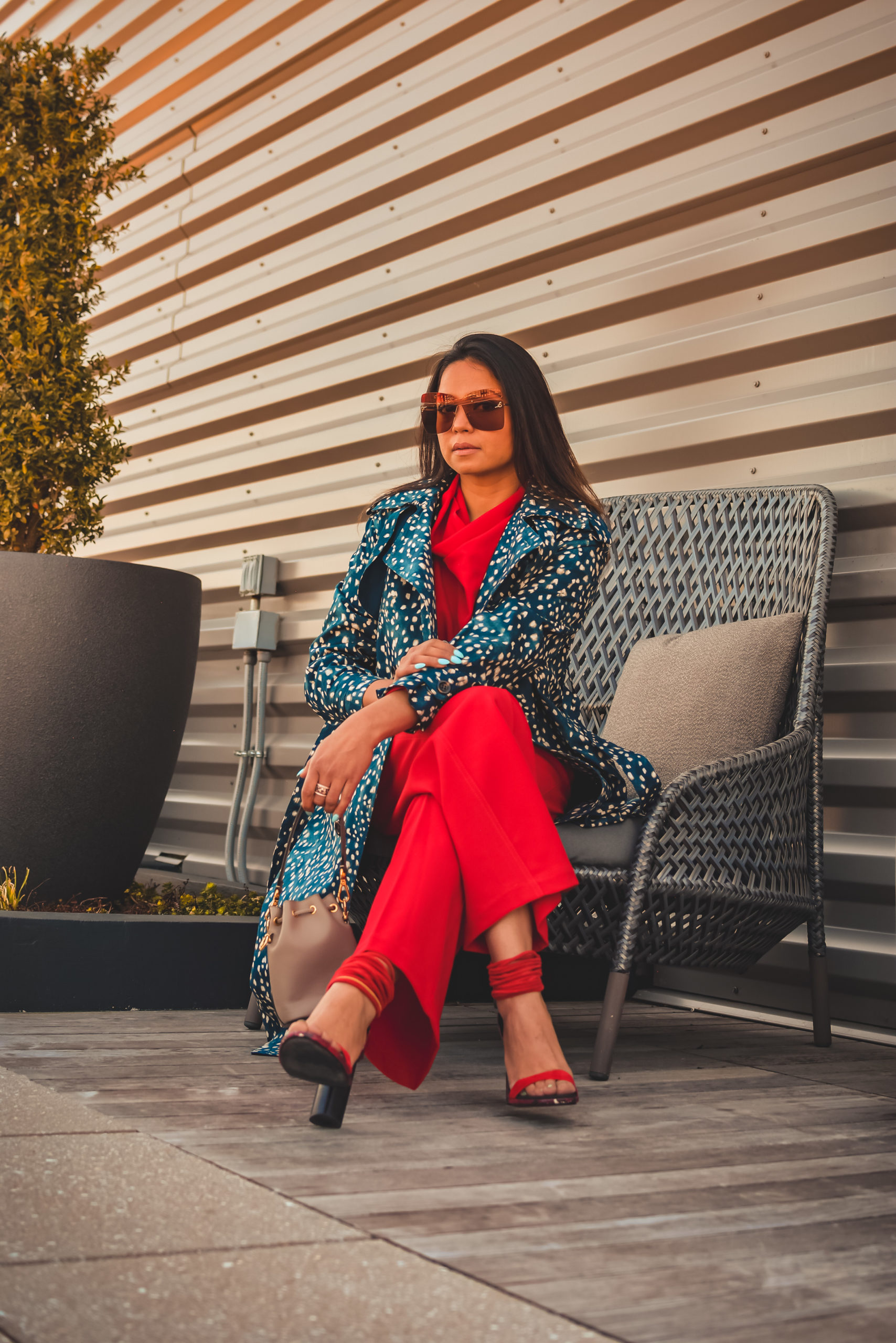 I am wearing a red pant and red blouse set with a pair of read sandals and a printed trench. this is my office look, street style look, spring outfit. Myriad Musings, saumya shiohare 