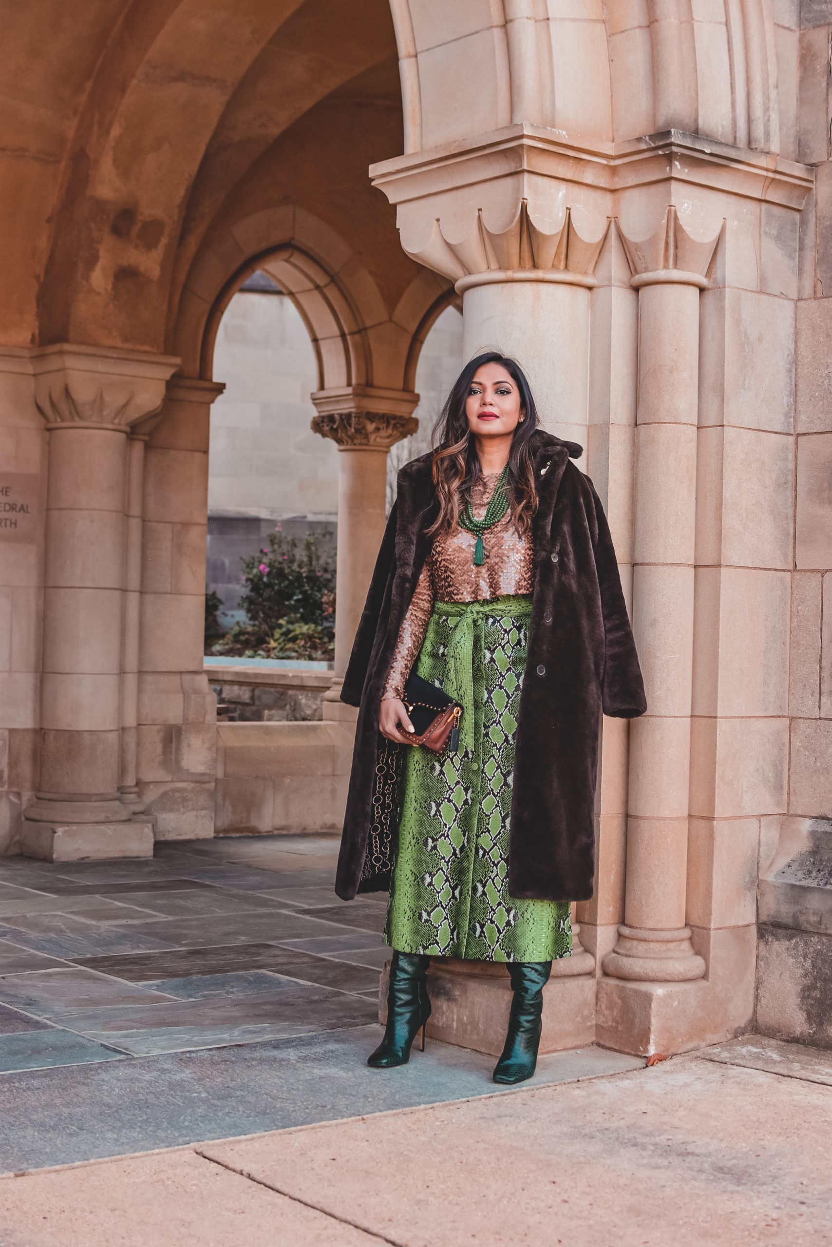 I am wearing a python print green leather skirt with a white blouse, citrus Valentino pumps and carrying a fendi bucket bag. Im talking about ways to transition your closet from winter to spring. myriad musings, saumya shiohare 