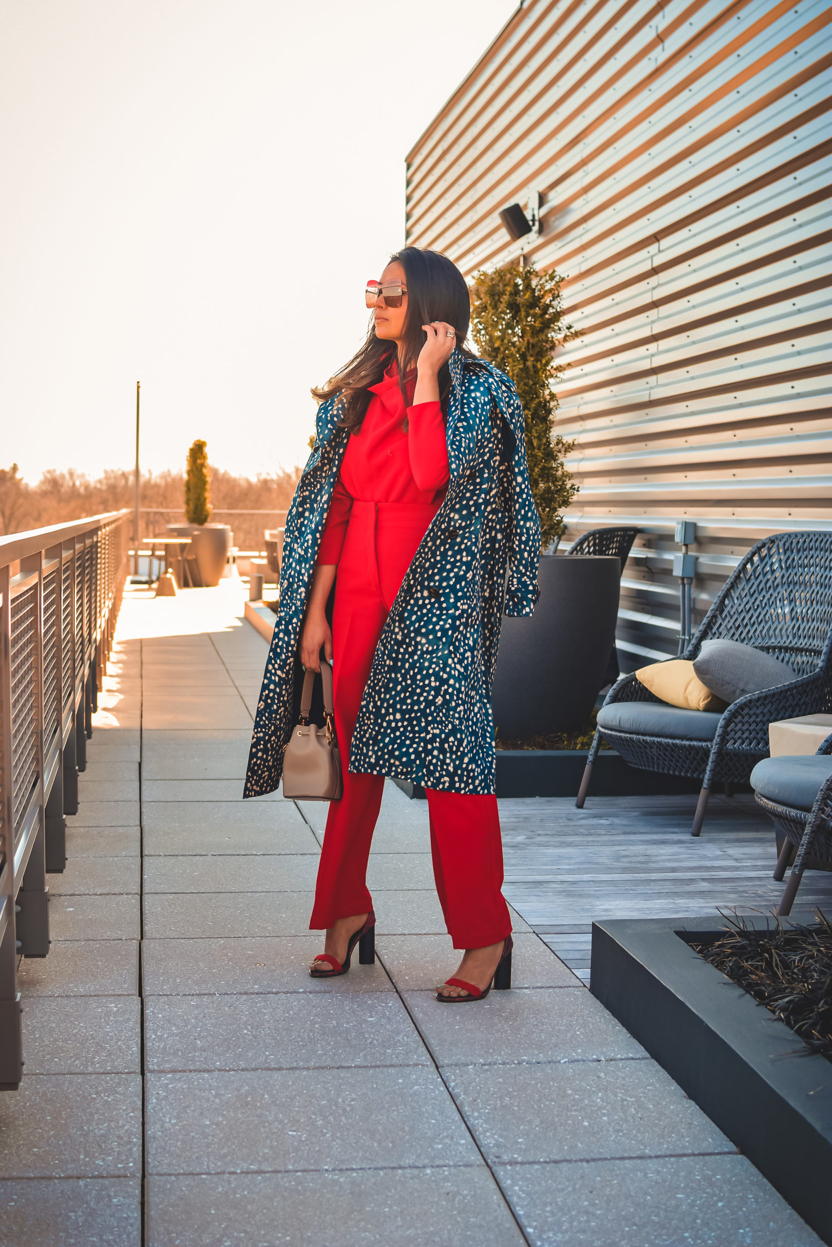 I am wearing a red pant and red blouse set with a pair of read sandals and a printed trench. this is my office look, street style look, spring outfit. Myriad Musings, saumya shiohare 