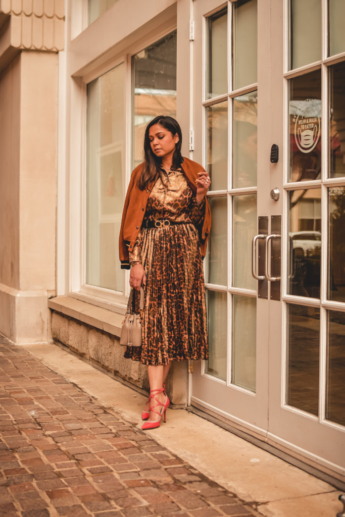 I am wearing a metallic leopard shirt with a metallic leopard skirt from J crew. I paired that with a. pair of orange Valentino heels, Ferragamo gancini belt in brown and a fendi bucket bag. Street style, myriad musings, how to wear leopard on leopard. print mixing 